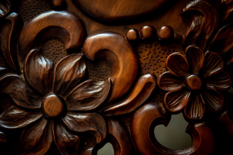 Close-up of vintage floral wood carving with decorative patterns, showcasing craftsmanship.